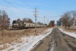 One of NS's Mane painted rebuilds provides the power for an outbound grain train